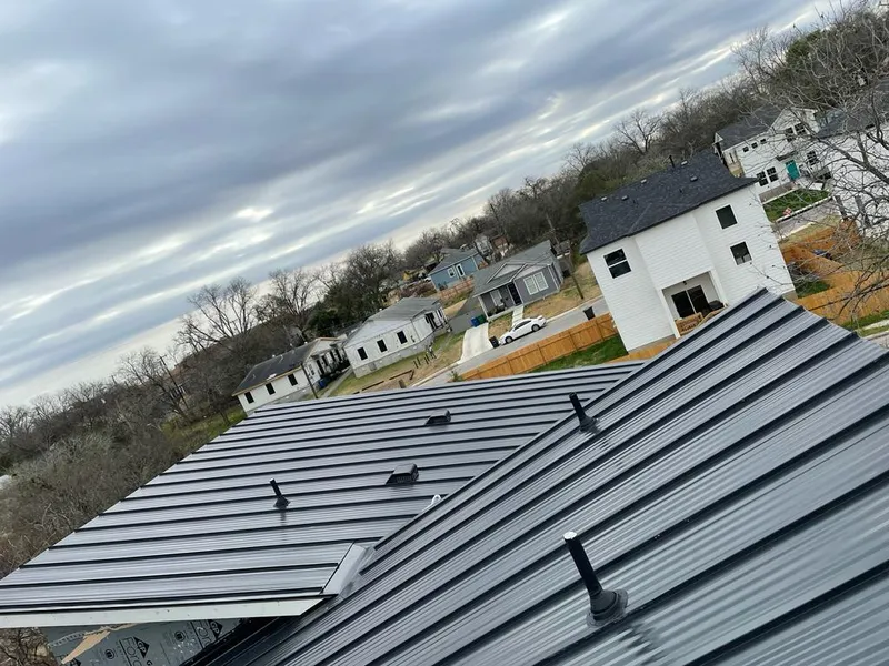 Standing seam metal roof panels with vents for Skylight Repair in Edmond